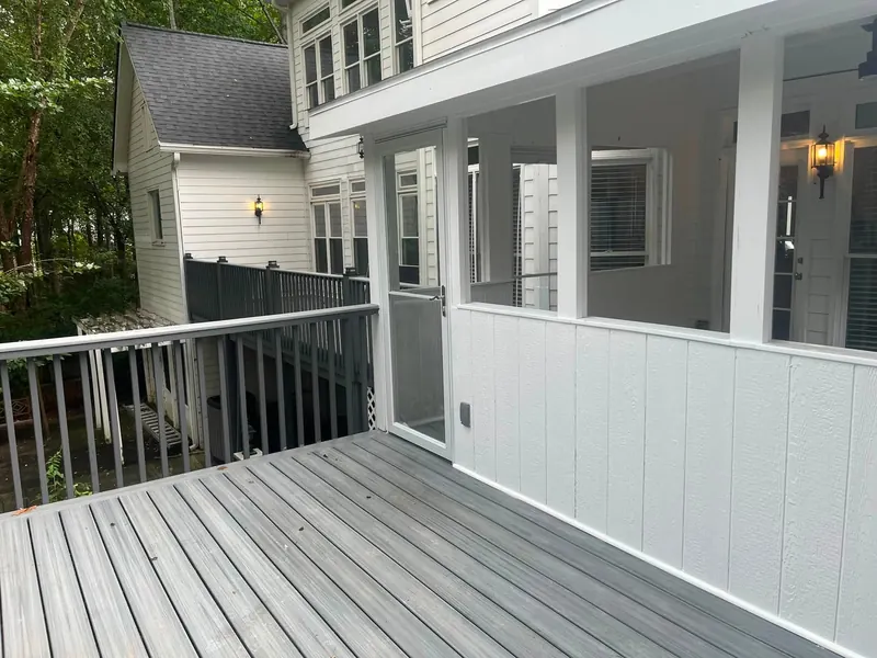 House exterior with newly built deck and screened porch addition